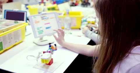 Children at school learning programming robot toy using tablet game. Stock Footage 260055675