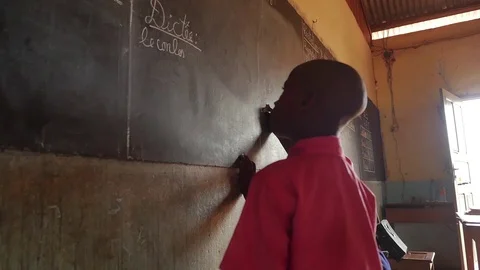 Children at school with the teacher write on the board Stock Footage 106517032