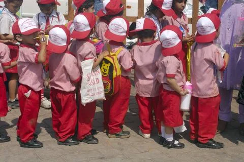Children in school uniform standing in queue at Kala Ghoda art festival 20... Stock Photos