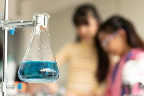 Children scientist doing science experiment test with chemistry in a labora.. Stock Photos