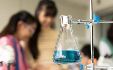 Children scientist doing science experiment test with chemistry in a labora.. Stock Photos