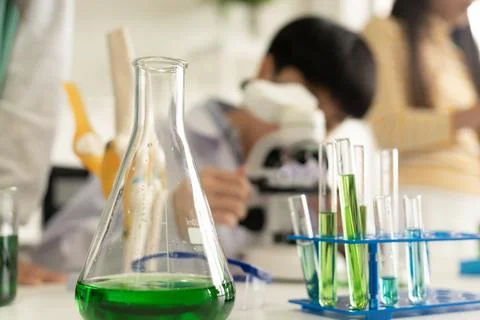Children scientist doing science experiment test with chemistry in a labora.. Stock Photos