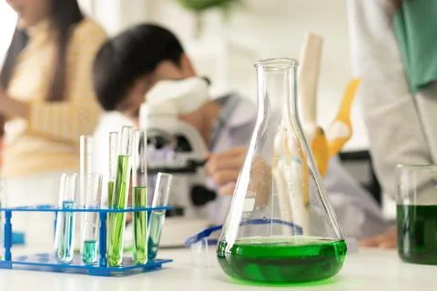 Children scientist doing science experiment test with chemistry in a labora.. Stock Photos