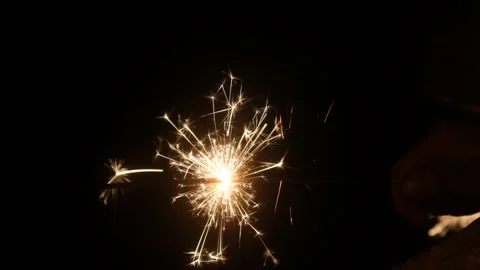 Children set off fireworks in the darkness of the night. Stock Footage 323364273
