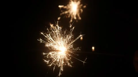 Children set off fireworks in the darkness of the night. Stock Footage 323364288