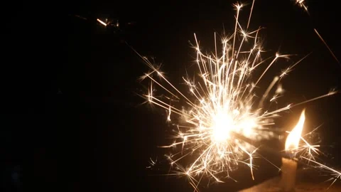 Children set off fireworks in the darkness of the night. Stock Footage 323364302
