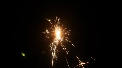 Children set off fireworks in the darkness of the night. Stock Footage 323364360