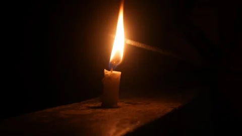 Children set off fireworks from lit candles at night. Stock Footage 323364341
