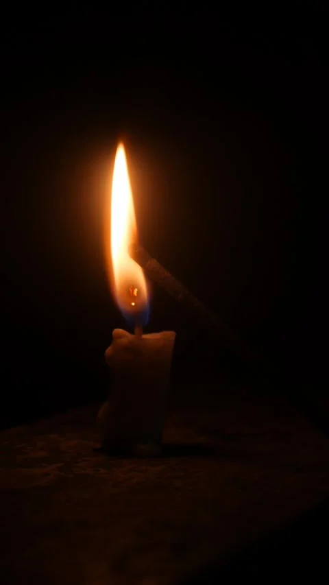 Children set off fireworks from lit candles at night. Stock Footage 323364448