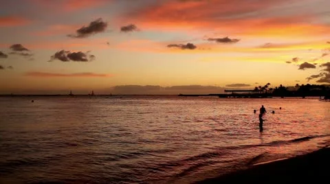 Children Silhoutte Playing at Tropical Waikiki Beach Sunset Stock Footage