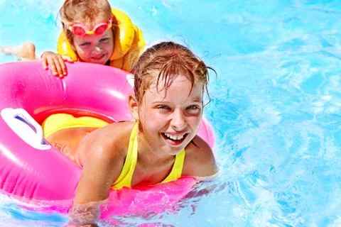 Children sitting on inflatable ring. Stock-Fotos