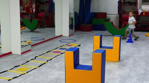 Children skipping obstacles on the training ground. Stock Footage 83624501