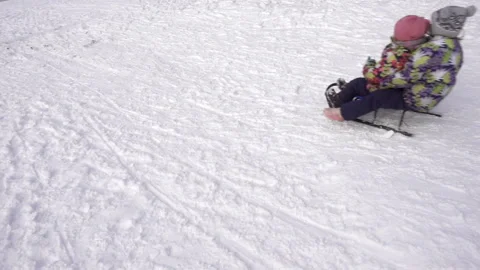 Children sledding in slow motion Stock Footage 164904363