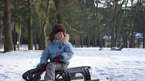 Children sledding on snow. Active fun for family Christmas vacation Stock Footage 91182537