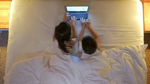  Children sleep in the bed. View from above. Stock Footage 77582934
