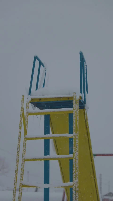 Children slide in deep snow in winter background Stock Footage 327687716