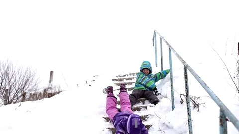 Children slip and fall down the broken stairs Stock Footage 72828328