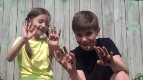Children smeared in the chocolate Stock Footage 159614006