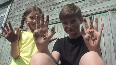 Children smeared in the chocolate Stock Footage 159614393