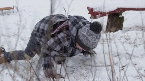 Children in the snow crawl Stock Footage 81790517