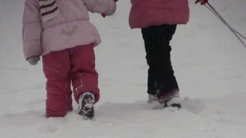 Children on a snow driven sleigh Stock-Footage 73674097
