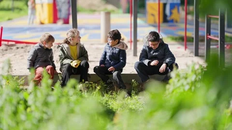 Children socializing together at the playground Stock Footage 327761319