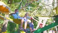 Children Spinning On The Attraction Stock Footage