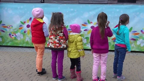 Children stand with their backs. Stock Footage 76316786