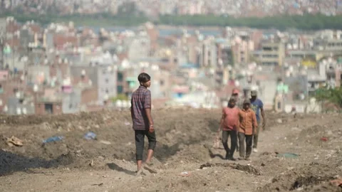 Children Standing On Garbage Mountain Overlooking Delhi City Skyline Stock Footage 248057449
