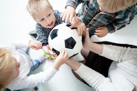 Children stretch to the ball Stock Photos