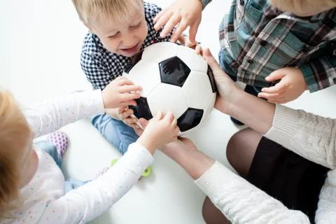 Children stretch to the ball Stock Photos