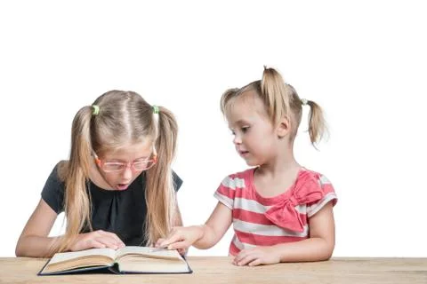 Children study the book Stock Photos