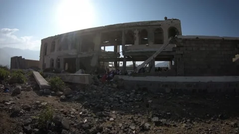 Children study inside a school destroyed by war in Yemen, Taiz Stock Footage 160209119