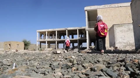 Children studying in a school destroyed by the war in Yemen Stock Footage 159431676