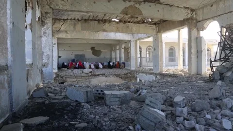 Children studying in a school destroyed by the war Stock Footage 159434485