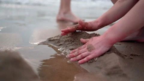 Children on summer vacation making on beach building sand castle together. kids Stock Footage 199231801