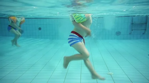 Children at a swimming pool Stock Footage 11859365