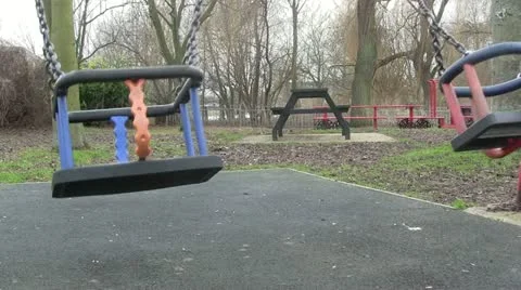 Children swing in a play ground. Stock-Footage 21013986