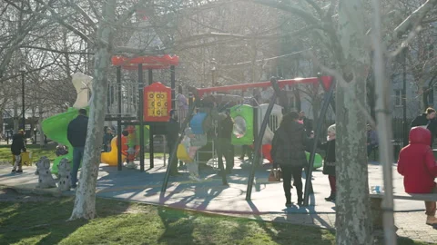 Children swing on a swing in the park 스톡 동영상 172303362