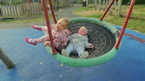 Children swinging on a swing Stock Footage 51221767