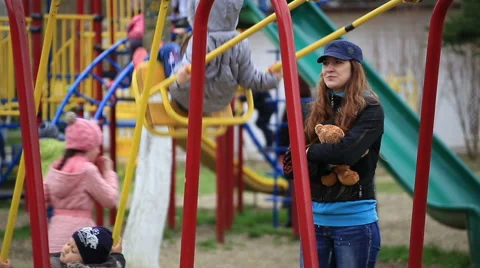 Children swinging on a swing Stock Footage 67363174