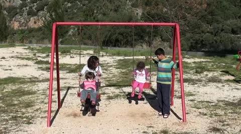 Children on swings 2 Stock Footage 20980930