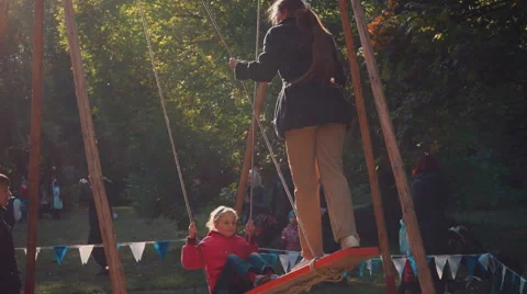 Children on swings 스톡 동영상 56974634