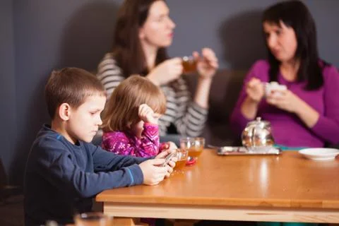 The children at the table Stock Photos