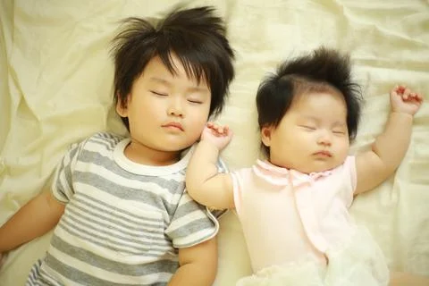 Children taking a nap Stock Photos
