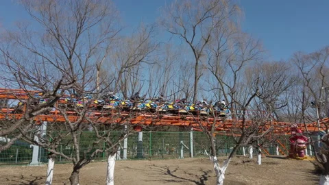Children taking roller coaster in amusement park, Beijing, China. Stock Footage 172458278