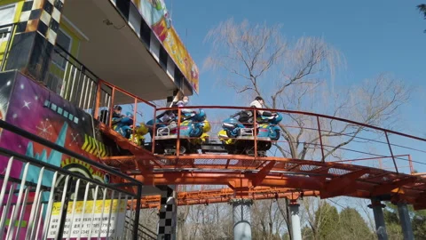 Children taking roller coaster in amusement park, Beijing, China. Stock Footage 172458300