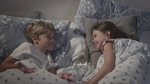 Children talking in bed. Stock Footage 165076569