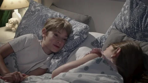 Children talking in bed. Stock Footage 165534650