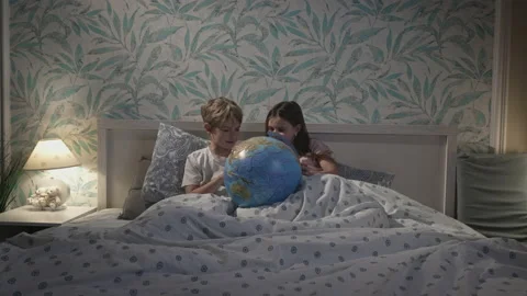 Children talking in bed. Stock Footage 165537778